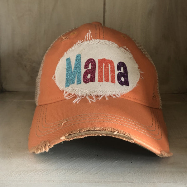 Mama Hat by BohoGroove with turquoise, pink, orange, and purple glitter Mama lettering on distressed off-white patch on a sherbet vintage distressed snapback