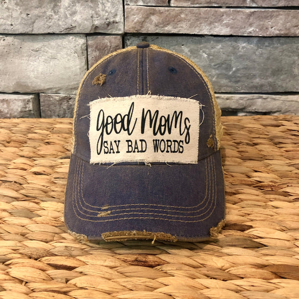 Good Moms Say Bad Words hat by BohoGroove with black Good Moms Say Bad Words lettering on a distressed off-white patch on a navy blue vintage distressed snapback trucker hat.