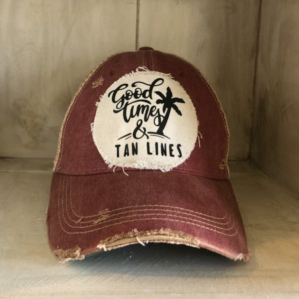 Good Times & Tan Lines hat by BohoGroove with black lettering and palm tree graphic on distressed off-white patch on brick red vintage distressed snapback.