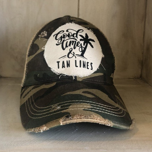 Good Times & Tan Lines hat by BohoGroove with black lettering and palm tree graphic on distressed off-white patch on camo vintage distressed snapback.