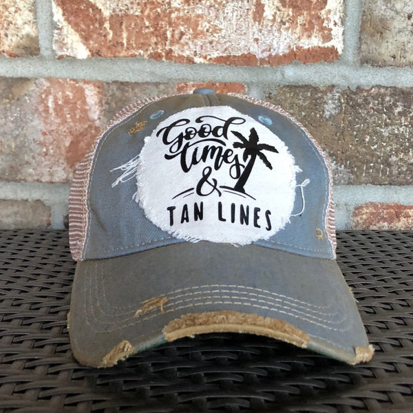 Good Times & Tan Lines hat by BohoGroove with black lettering and palm tree graphic on distressed off-white patch on light blue vintage distressed snapback.