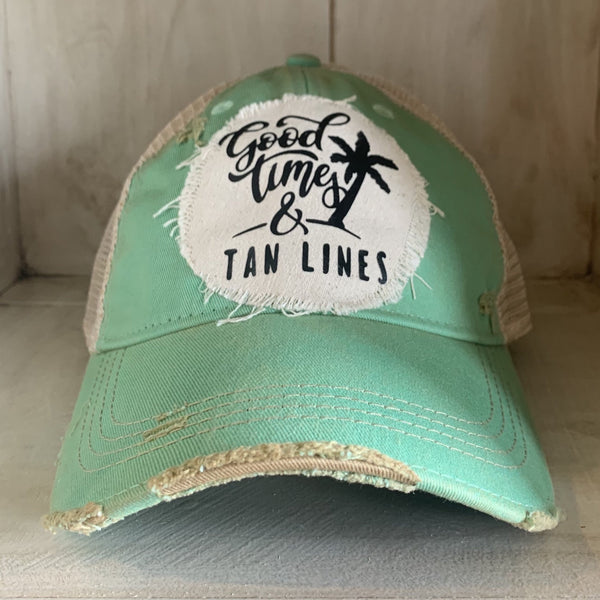 Good Times & Tan Lines hat by BohoGroove with black lettering and palm tree graphic on distressed off-white patch on mint vintage distressed snapback.