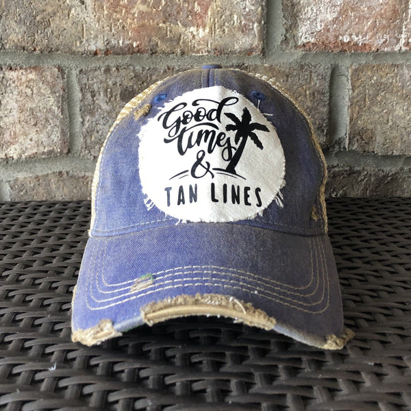 Good Times & Tan Lines hat by BohoGroove with black lettering and palm tree graphic on distressed off-white patch on royal blue vintage distressed snapback.