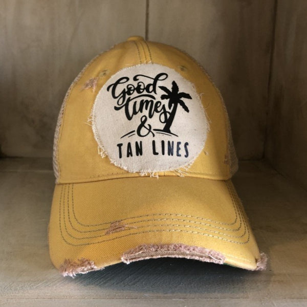 Good Times & Tan Lines hat by BohoGroove with black lettering and palm tree graphic on distressed off-white patch on yellow vintage distressed snapback.