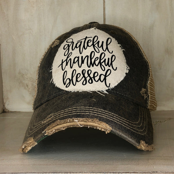 Grateful Thankful Blessed hat by BohoGroove with black grateful thankful blessed script lettering on a cream patch on a black vintage distressed snapback.