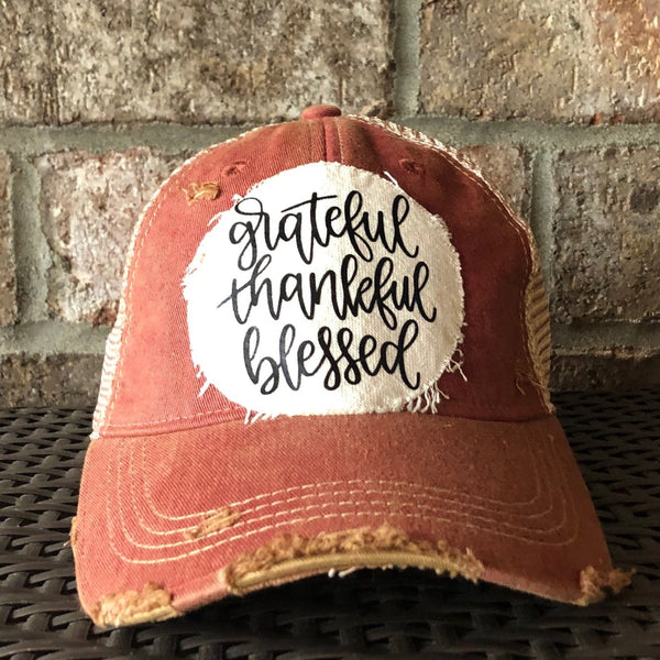 Grateful Thankful Blessed hat by BohoGroove with black grateful thankful blessed script lettering on a cream patch on a brick red vintage distressed snapback.