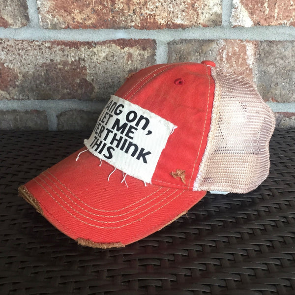 Right side view Hang On Let Me Overthink This hat by BohoGroove with black Hang On Let Me Overthink This lettering on a distressed off-white patch on a red vintage distressed snapback trucker hat.
