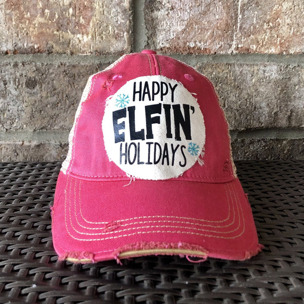 Happy Elfin' Holidays hat by BohoGroove with black lettering and blue snowflake graphics on a distressed off-white custom patch on a pink vintage distressed snapback.