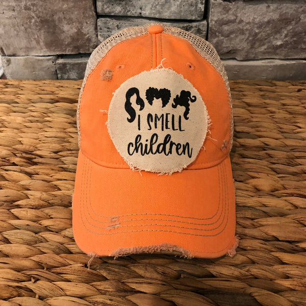 Hocus Pocus I Smell Children hat by BohoGroove with black witch silhouette graphic and I Smell Children wording on a distressed off-white patch on a sherbet vintage distressed snapback.
