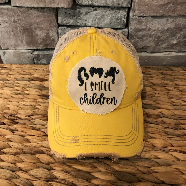 Hocus Pocus I Smell Children hat by BohoGroove with black witch silhouette graphic and I Smell Children wording on a distressed off-white patch on a yellow vintage distressed snapback.
