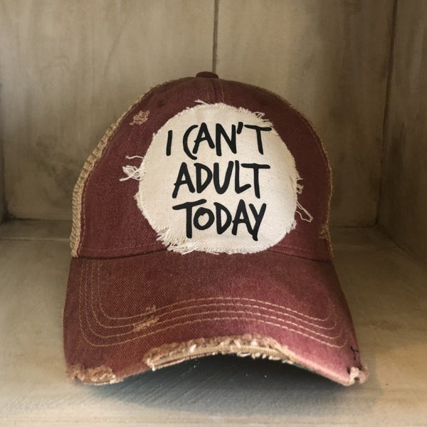 I Can't Adult Today hat by BohoGroove with black lettering on a distressed off-white patch on a brick red vintage distressed snapback trucker hat.