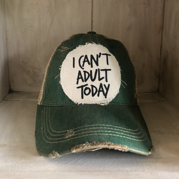 I Can't Adult Today hat by BohoGroove with black lettering on a distressed off-white patch on a green vintage distressed snapback trucker hat.