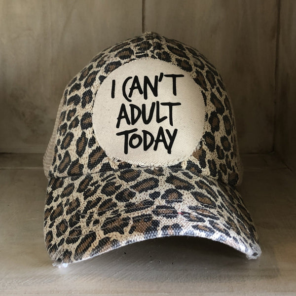 I Can't Adult Today hat by BohoGroove with black lettering on a distressed off-white patch on a leopard vintage distressed snapback trucker hat.
