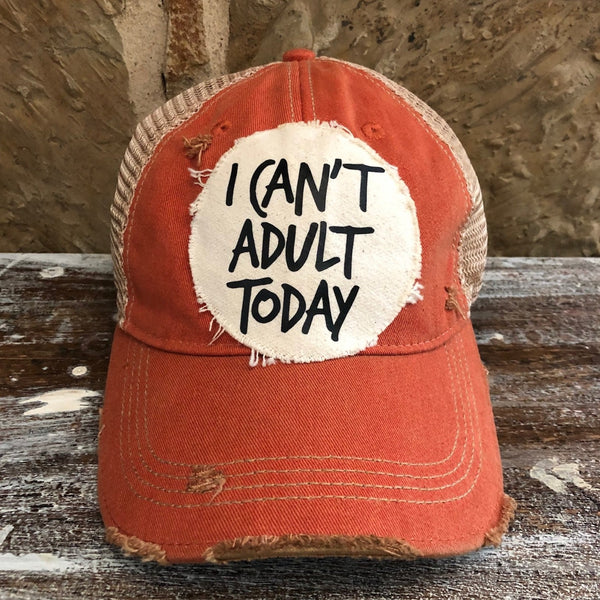 I Can't Adult Today hat by BohoGroove with black lettering on a distressed off-white patch on an orange vintage distressed snapback trucker hat.