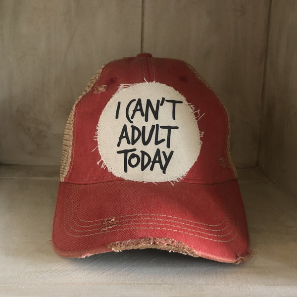 I Can't Adult Today hat by BohoGroove with black lettering on a distressed off-white patch on a red vintage distressed snapback trucker hat.