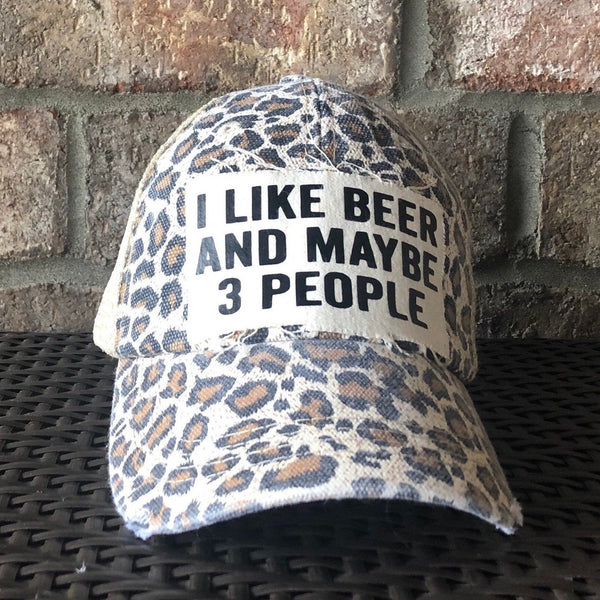 I Like Beer and Maybe 3 People hat by BohoGroove with black lettering on a distressed off-white custom patch on a leopard vintage distressed snapback.
