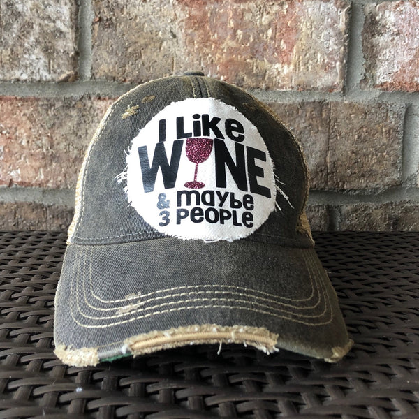 I Like Wine and Maybe 3 People hat by BohoGroove with black lettering and a glitter wine glass graphic on a distressed off-white patch on a black vintage distressed snapback.