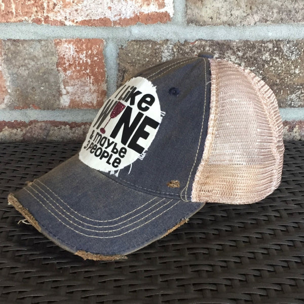 Right  side of I Like Wine and Maybe 3 People hat by BohoGroove with black lettering and a glitter wine glass graphic on a distressed off-white patch on a navy blue vintage distressed snapback.
