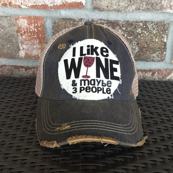 I Like Wine and Maybe 3 People hat by BohoGroove with black lettering and a glitter wine glass graphic on a distressed off-white patch on a navy blue vintage distressed snapback.
