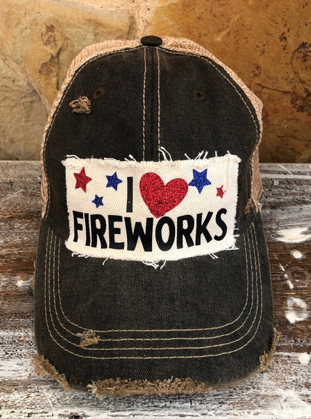 I Love Fireworks hat by BohoGroove with black lettering, red glitter heart, and red and blue stars on distressed off-white patch and black vintage distressed snapback