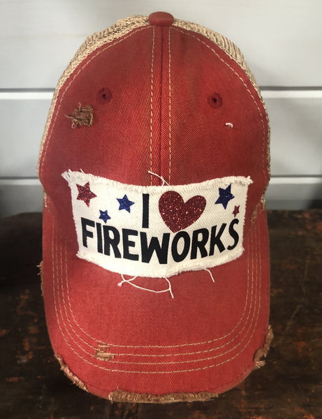 I Love Fireworks hat by BohoGroove with black lettering, red glitter heart, and red and blue stars on distressed off-white patch and red vintage distressed snapback
