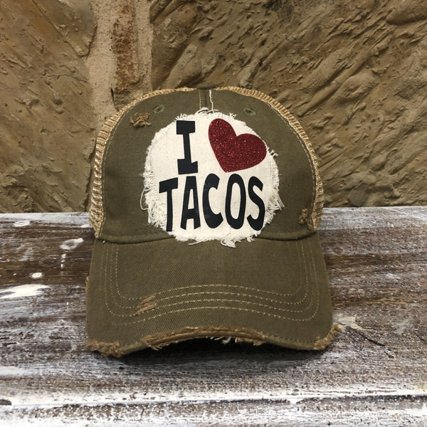 Olive Green distressed snapback hat featuring an off-white I Love Tacos patch with a red glitter heart