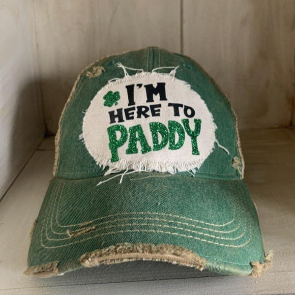 I'm Here to Paddy hat by BohoGroove with green lettering and shamrock graphic on a distressed off-white custom patch on a green vintage distressed snapback.