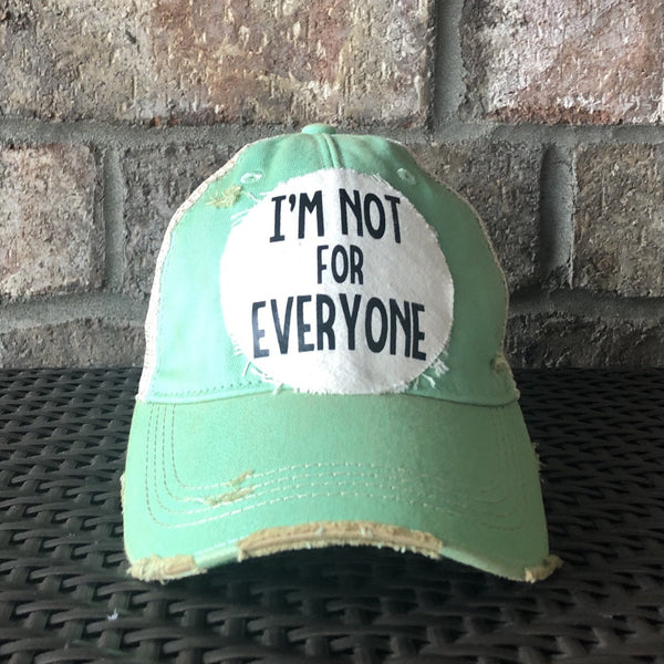 Im Not For Everyone hat by BohoGroove with black lettering on distressed off-white patch on mint vintage distressed snapback.