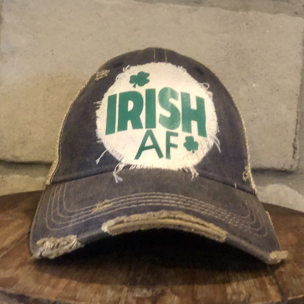 Irish AF hat by BohoGroove with green lettering and shamrock graphic on a distressed off-white custom patch on a navy blue vintage distressed snapback.