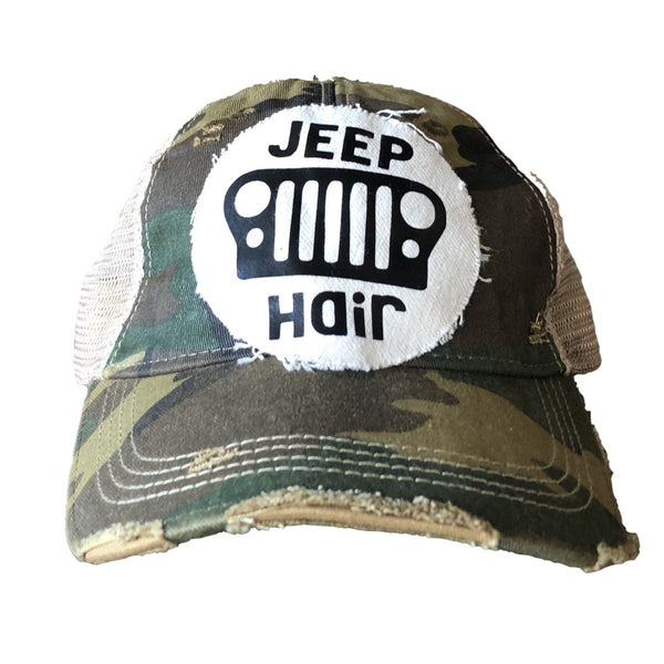 Jeep Hair hat by BohoGroove with black Jeep Hair lettering and Jeep grille graphic on a distressed off-white patch on a camo vintage distressed snapback.