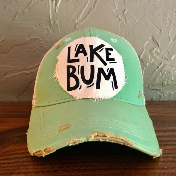 Lake Bum hat by BohoGroove with black Lake Bum lettering on distressed off-white patch on a mint green vintage distressed snapback.