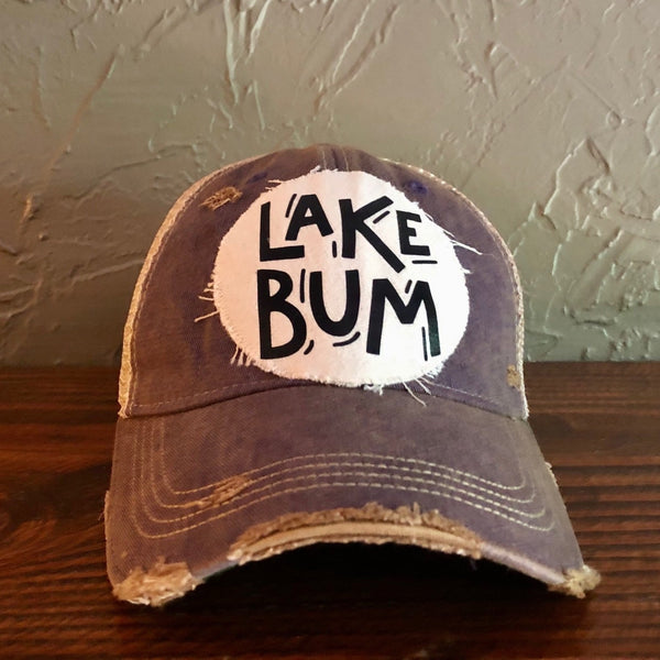 Lake Bum hat by BohoGroove with black Lake Bum lettering on distressed off-white patch on a purple vintage distressed snapback.