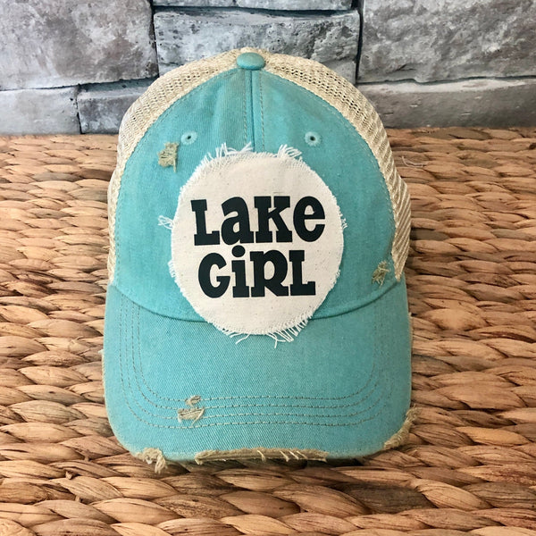 Lake Girl hat by BohoGroove with black Lake Girl lettering on distressed off-white patch on an ocean blue vintage distressed snapback.