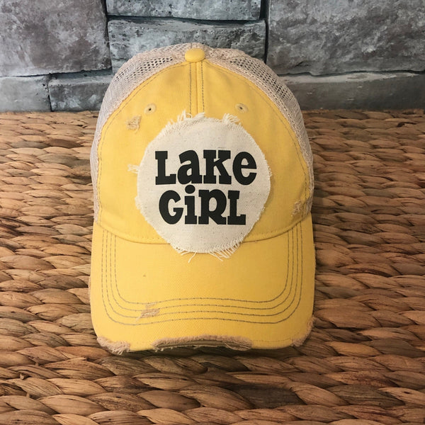 Lake Girl hat by BohoGroove with black Lake Girl lettering on distressed off-white patch on a yellow vintage distressed snapback.