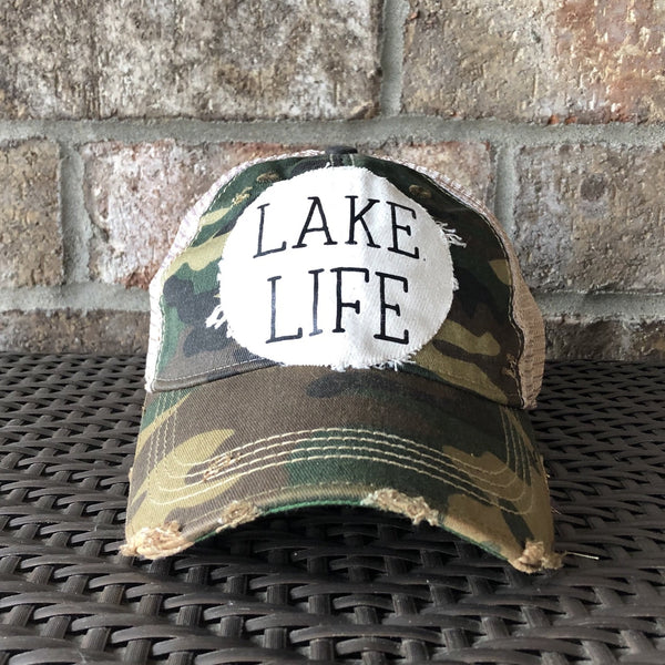 Lake Life hat by BohoGroove with black Lake Life lettering on distressed off-white patch on a camo vintage distressed snapback.