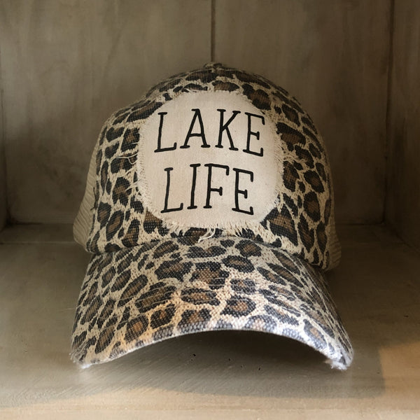 Lake Life hat by BohoGroove with black Lake Life lettering on distressed off-white patch on a leopard vintage distressed snapback.