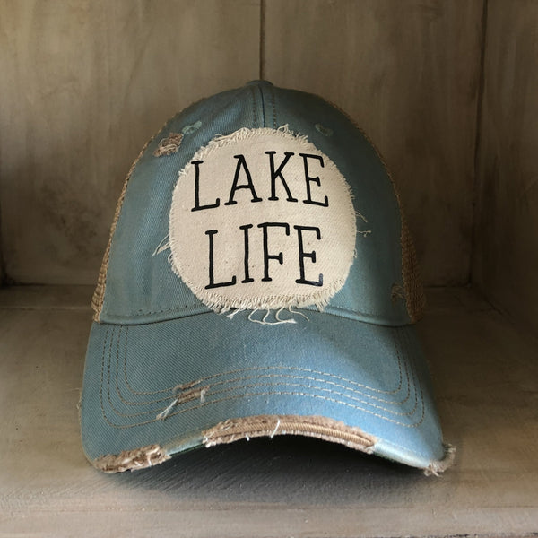 Lake Life hat by BohoGroove with black Lake Life lettering on distressed off-white patch on an ocean blue vintage distressed snapback.