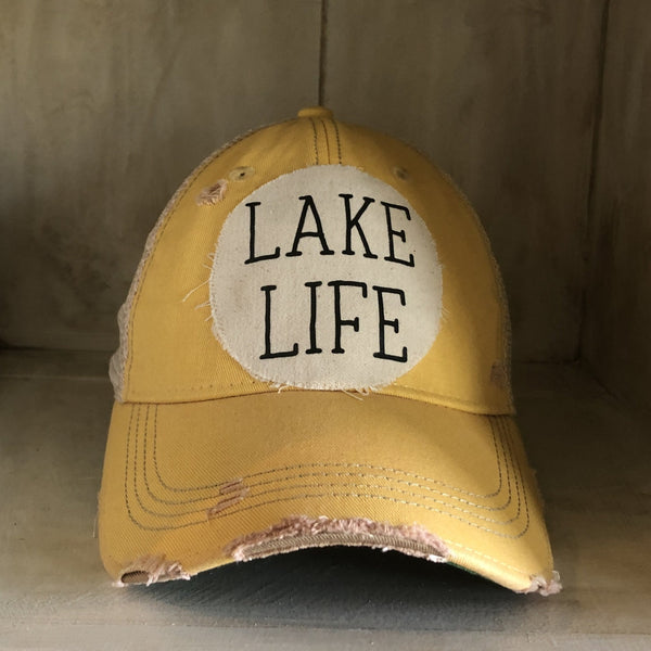 Lake Life hat by BohoGroove with black Lake Life lettering on distressed off-white patch on a yellow vintage distressed snapback.