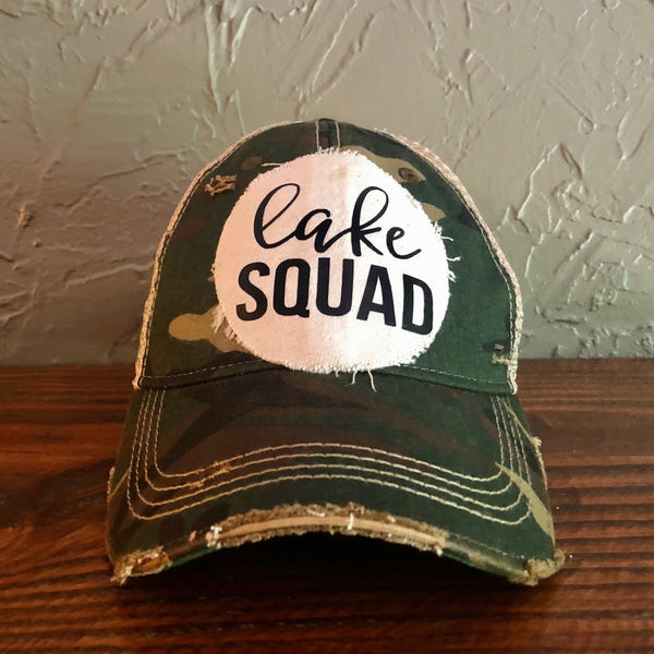 Lake Squad hat by BohoGroove with black Lake Squad lettering on distressed off-white patch on a camo vintage distressed snapback.