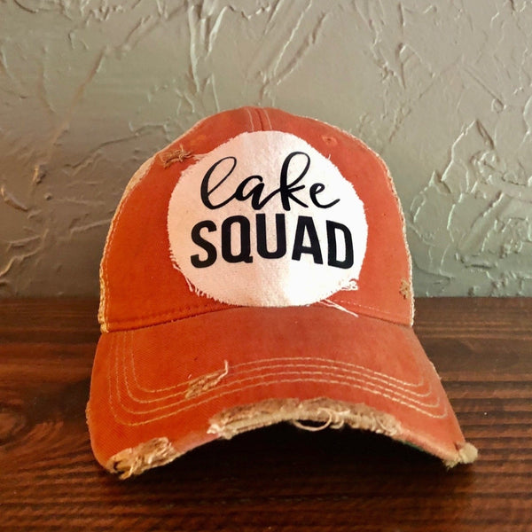 Lake Squad hat by BohoGroove with black Lake Squad lettering on distressed off-white patch on a orange vintage distressed snapback.