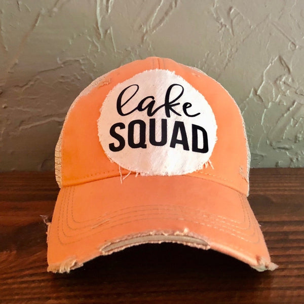 Lake Squad hat by BohoGroove with sherbet Lake Squad lettering on distressed off-white patch on a sherbet vintage distressed snapback.