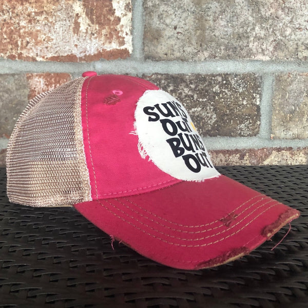 Suns Out Buns Out hat by BohoGroove with black lettering and yellow sun graphic on distressed off-white patch on pink vintage distressed snapback.