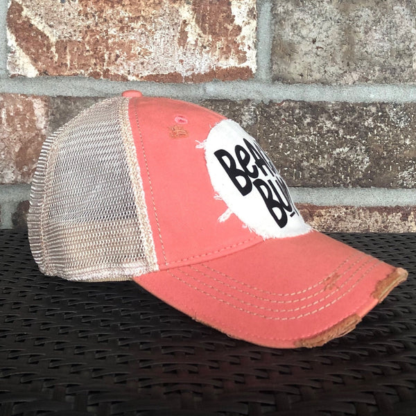 Beach Bum hat by BohoGroove with black Beach Bum lettering on distressed off-white patch on a sherbet vintage distressed snapback.