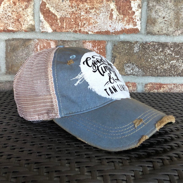 Good Times & Tan Lines hat by BohoGroove with black lettering and palm tree graphic on distressed off-white patch on light blue vintage distressed snapback.