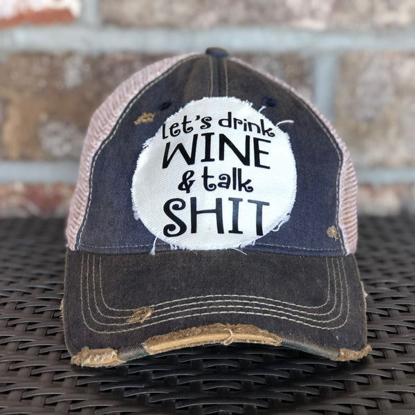 Let’s Drink Wine and Talk Shit hat by BohoGroove with black lettering on a distressed off-white patch on a navy blue vintage distressed snapback.