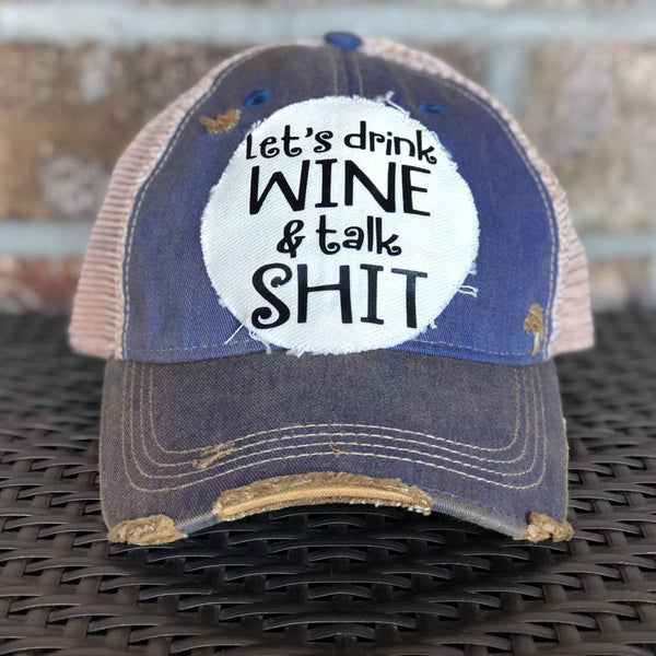 Let’s Drink Wine and Talk Shit hat by BohoGroove with black lettering on a distressed off-white patch on a royal blue vintage distressed snapback.