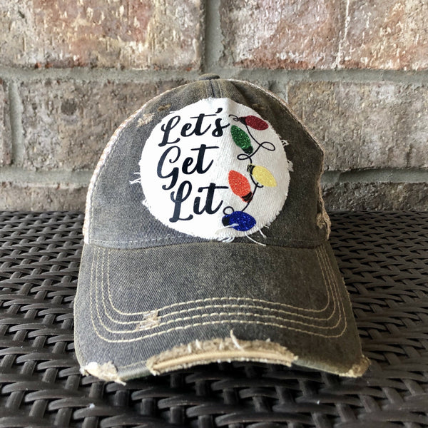 Let's Get Lit hat by BohoGroove with black Let's Get Lit script lettering and multicolor glitter Christmas light graphics on a distressed off-white custom patch on a black vintage distressed snapback.