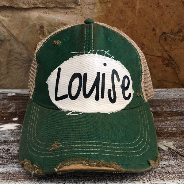 Louise hat by BohoGroove with black Louise lettering on a distressed off-white patch on a green vintage distressed snapback.