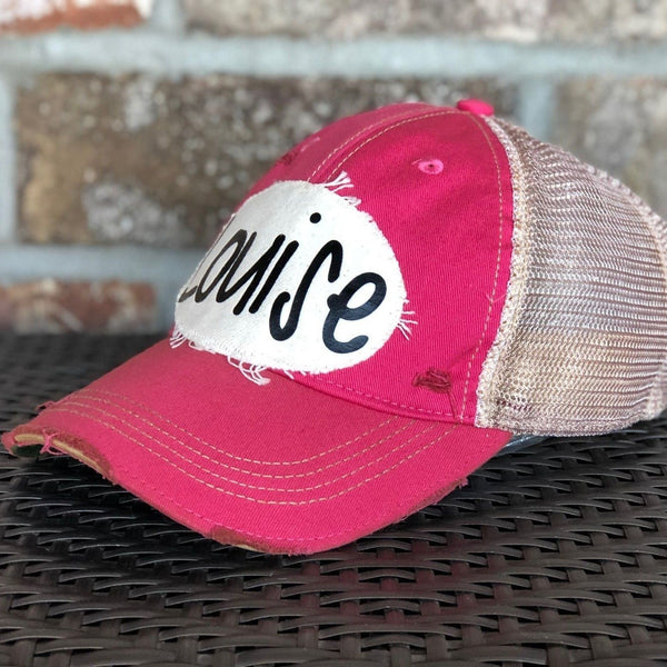 Right side view of Louise hat by BohoGroove with black Louise lettering on a distressed off-white patch on a pink vintage distressed snapback.
