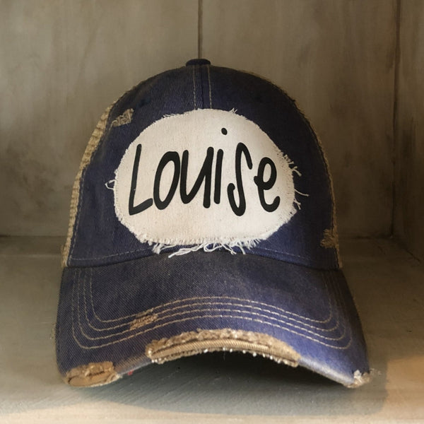 Louise hat by BohoGroove with black Louise lettering on a distressed off-white patch on a royal blue vintage distressed snapback.